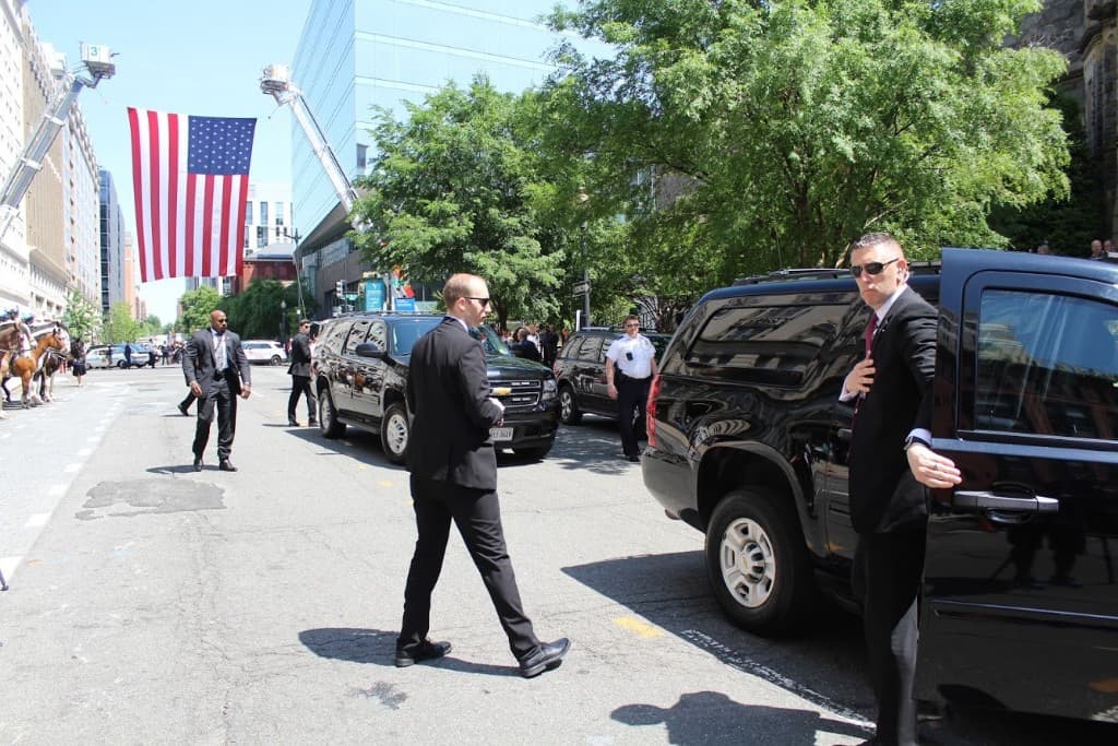 Rob Gunderson working a protective detail during National Police Week in Washington, D.C., with mounted police and an American flag behind